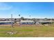 Exterior of a one-story home with a fenced yard and palm trees at 1021 Augusta Dr, Sun City Center, FL 33573