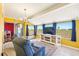 Bright Florida Room with neutral flooring, large windows, and a view of the green space outside at 1021 Augusta Dr, Sun City Center, FL 33573