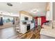 Open-concept kitchen boasts modern appliances, stylish stone countertops, and seamless flow into the living area at 1021 Augusta Dr, Sun City Center, FL 33573