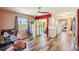 Charming eat-in kitchen featuring wood-look flooring, stainless steel appliances, and a cozy dining area at 1021 Augusta Dr, Sun City Center, FL 33573