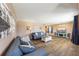 Spacious living room featuring hardwood floors, comfortable seating, and a modern entertainment center at 1021 Augusta Dr, Sun City Center, FL 33573