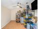 Bonus room featuring a ceiling fan, laminated floor, shelves, and storage at 106 Grove St, Brandon, FL 33510