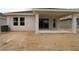 Home featuring a covered patio, perfect for outdoor relaxation and entertaining, with sliding glass door access at 10640 Crescent Creek Xing, Parrish, FL 34219