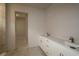 Bathroom featuring double sink vanity with white cabinets and marble flooring at 10640 Crescent Creek Xing, Parrish, FL 34219