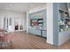 Modern lobby with stylish seating, built-in shelves, and a welcome display at 10640 Crescent Creek Xing, Parrish, FL 34219