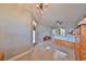 Bright main bedroom featuring a ceiling fan, and access to the outdoors at 1123 Signature Dr, Sun City Center, FL 33573