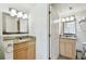 Elegant bathroom with double sinks, granite countertops, and modern fixtures at 11605 Gulf Blvd # 404, Treasure Island, FL 33706