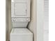 Stacked washer and dryer unit in a utility closet at 11605 Gulf Blvd # 404, Treasure Island, FL 33706