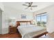 Relax in the comfortable main bedroom with a large bed, soft lighting, and ocean views at 11605 Gulf Blvd # 404, Treasure Island, FL 33706