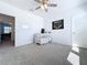 Bright bedroom featuring neutral carpeting and a stylish ceiling fan at 11828 Cara Field Ave, Riverview, FL 33579