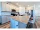 Bright kitchen featuring white cabinets, stainless steel appliances, a granite island with barstool seating at 11828 Cara Field Ave, Riverview, FL 33579