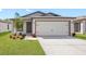Charming single-Gathering home with a well-manicured lawn and a two-car garage at 12077 Centralia Rd, Weeki Wachee, FL 34614