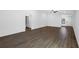 Spacious open-concept living room featuring wood-look floors and abundant natural light at 12234 Ipswich Sparrow Rd, Weeki Wachee, FL 34614