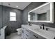 Modern bathroom featuring double sink vanity, an LED mirror and tiled floors and walls at 1235 14Th N St, St Petersburg, FL 33705