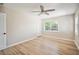 Well-lit bedroom with hardwood floors, ceiling fan, and closet space at 1235 14Th N St, St Petersburg, FL 33705