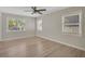 Inviting bedroom with natural light, hardwood floors, and a ceiling fan at 1235 14Th N St, St Petersburg, FL 33705