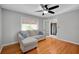 Bedroom featuring hardwood floors, large window, ceiling fan and natural light at 1235 14Th N St, St Petersburg, FL 33705