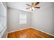 Bedroom with hardwood floors, a ceiling fan and a window with natural light at 1235 14Th N St, St Petersburg, FL 33705