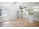 Bright bedroom with hardwood floors, ceiling fan, and mirrored closet doors at 1235 14Th N St, St Petersburg, FL 33705