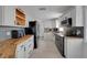 Modern kitchen with white cabinets, stainless steel appliances, and butcher block countertops at 1235 14Th N St, St Petersburg, FL 33705