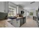 Well-lit kitchen with wood countertops, tiled backsplash, stainless appliances, and breakfast nook at 1235 14Th N St, St Petersburg, FL 33705