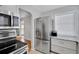 Well lit kitchen featuring stainless steel appliances and granite countertops at 1235 14Th N St, St Petersburg, FL 33705