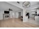 Open-concept living space with hardwood floors, fireplace, and easy access to kitchen at 1235 14Th N St, St Petersburg, FL 33705