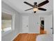 Bedroom with hardwood floors, a ceiling fan, and natural light from the window at 1235 14Th N St, St Petersburg, FL 33705