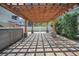 Backyard patio with brick pavers, wood pergola, and hot tub offers a relaxing outdoor space at 1235 14Th N St, St Petersburg, FL 33705