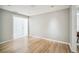 Light-filled room showcasing hardwood floors, neutral paint, and open doorway at 1235 14Th N St, St Petersburg, FL 33705