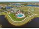 Resort-style community pool with ample seating, spa, playground, tennis and lakeside views at 13538 Willow Bluestar Loop, Riverview, FL 33579