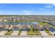 Aerial view of neighborhood featuring lake views and well-maintained homes at 13538 Willow Bluestar Loop, Riverview, FL 33579
