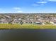 Aerial view of neighborhood featuring waterfront properties, lakes and ponds at 13538 Willow Bluestar Loop, Riverview, FL 33579