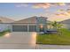 Beautiful single-Gathering home with a well-kept lawn and a spacious three-car garage at 13538 Willow Bluestar Loop, Riverview, FL 33579