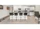 Beautiful kitchen featuring white cabinets, granite countertops, and stainless steel appliances at 13538 Willow Bluestar Loop, Riverview, FL 33579