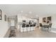 Bright kitchen with stainless steel appliances, white cabinetry, and a breakfast bar with seating at 13538 Willow Bluestar Loop, Riverview, FL 33579