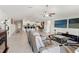 Spacious living area showcasing seamless transition to the kitchen and comfortable seating arrangement at 13538 Willow Bluestar Loop, Riverview, FL 33579