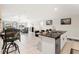 Bright, open floor plan connecting the kitchen and living area, perfect for modern living and entertaining at 13538 Willow Bluestar Loop, Riverview, FL 33579
