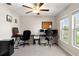 Dedicated home office featuring natural light, two workstations, and neutral paint at 13538 Willow Bluestar Loop, Riverview, FL 33579