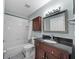 Well-lit bathroom with a tub and shower combination, modern vanity and updated features at 14916 Rocky Ledge Dr, Tampa, FL 33625