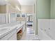 Spacious bathroom boasts double sinks, tub and shower; view to main bedroom at 14916 Rocky Ledge Dr, Tampa, FL 33625