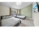 A bedroom with two beds, a large window and an entertainment center at 14916 Rocky Ledge Dr, Tampa, FL 33625