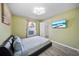 Inviting bedroom featuring a large window and attached closet with plenty of room at 14916 Rocky Ledge Dr, Tampa, FL 33625