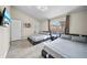 A bedroom with two beds and a window that looks out to the community pool at 14916 Rocky Ledge Dr, Tampa, FL 33625