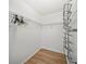 Walk-in closet featuring white wire shelving and light wood flooring at 14916 Rocky Ledge Dr, Tampa, FL 33625