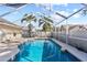 Sparkling screened-in pool with clear blue water and patio area at 14916 Rocky Ledge Dr, Tampa, FL 33625