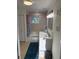 Bright bathroom features a white vanity, modern lighting, and a shower-tub combination at 2005 Jackson N St, St Petersburg, FL 33704