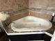 Luxurious bathtub featuring mosaic tiles and offering a relaxing spa-like experience at 2005 Jackson N St, St Petersburg, FL 33704