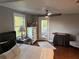 A serene bedroom with a ceiling fan, balcony access, and stylish decor at 2005 Jackson N St, St Petersburg, FL 33704