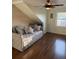 Cozy bedroom featuring hardwood floors, a daybed with plush pillows, and a ceiling fan at 2005 Jackson N St, St Petersburg, FL 33704